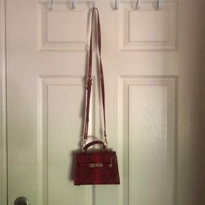 Cute black and red snake skinned bag from fashion nova